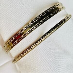 Two silver colored bracelets